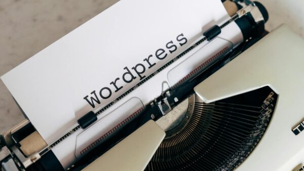 white vintage typewriter with paper